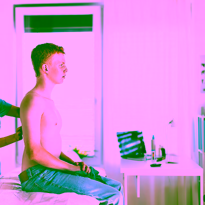 Doctor performing skin screening on patient